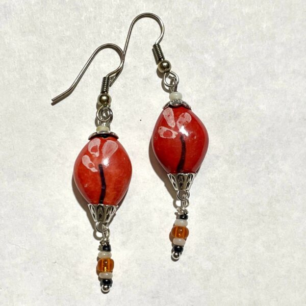 Red beaded dangle earrings with silver accents