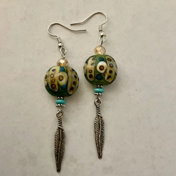 Pair of beaded earrings with feather charms