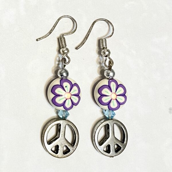 Pair of purple flower peace-sign earrings