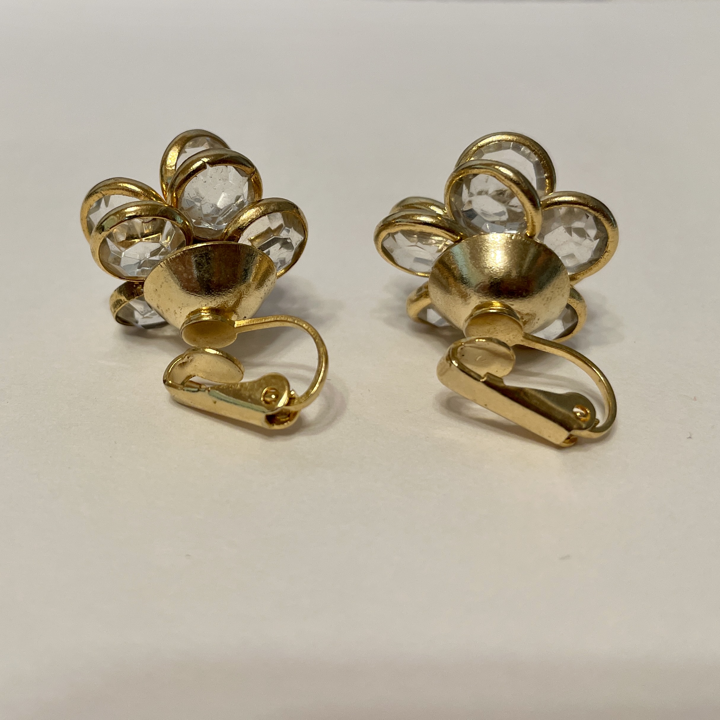 Pair of gold clip-on earrings with crystals