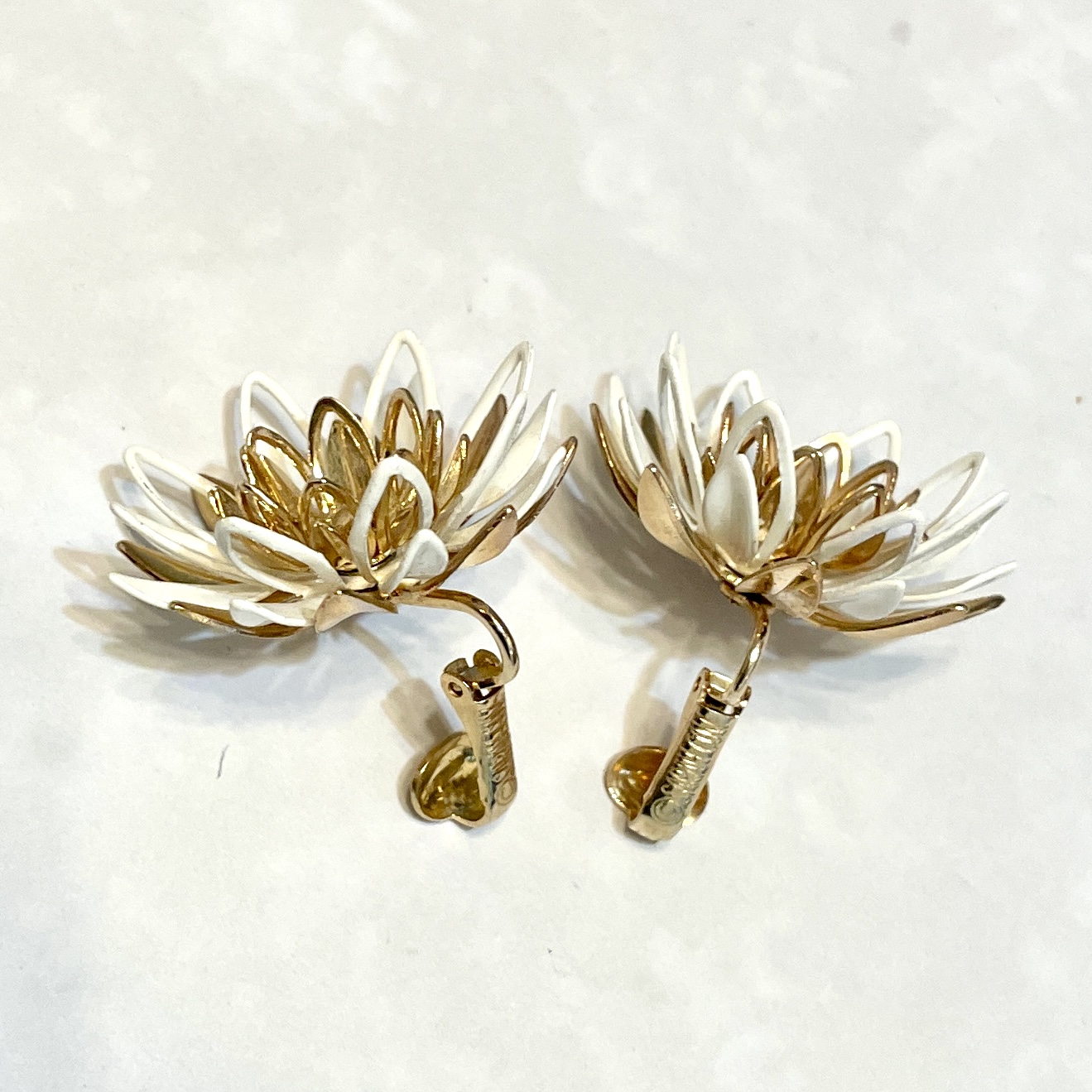 White and gold lotus clip-on earrings