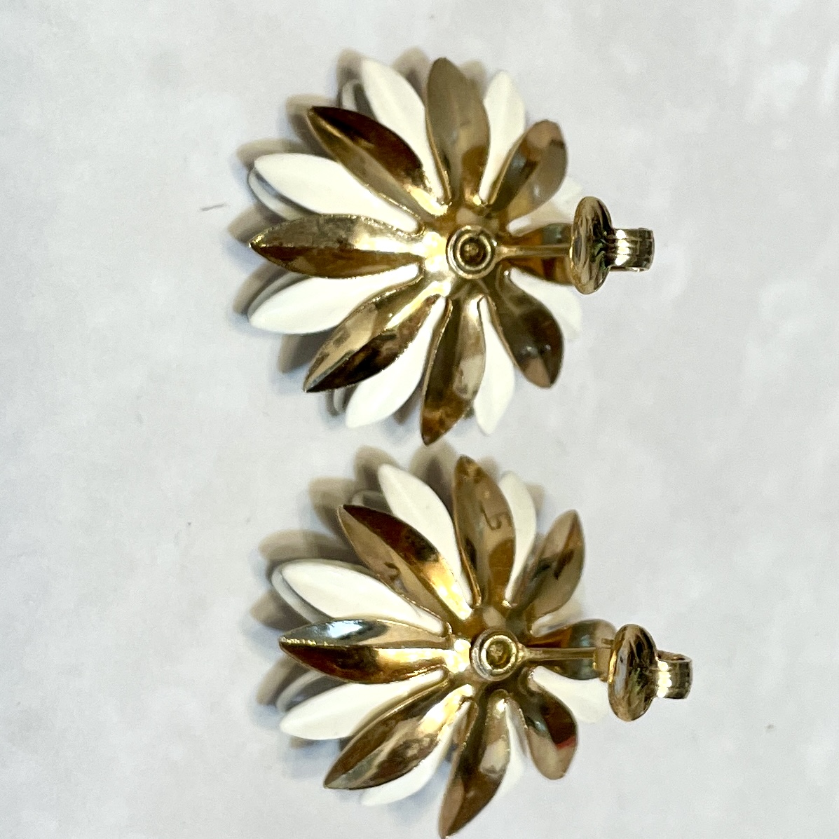 Gold and white floral clip-on earrings