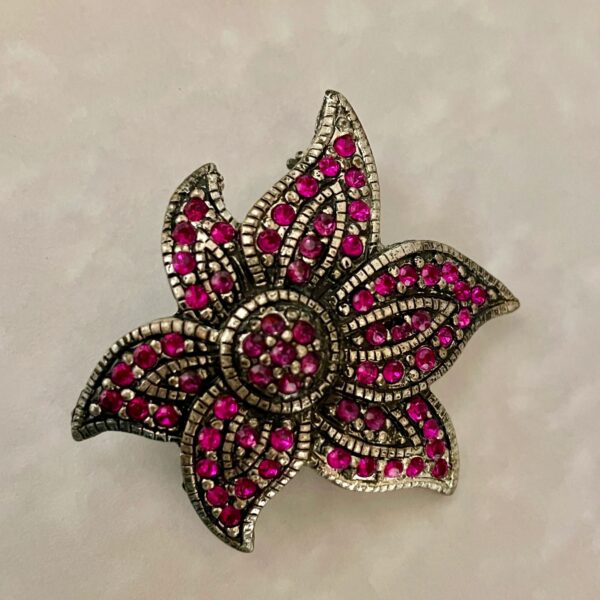 Silver flower brooch with pink rhinestones