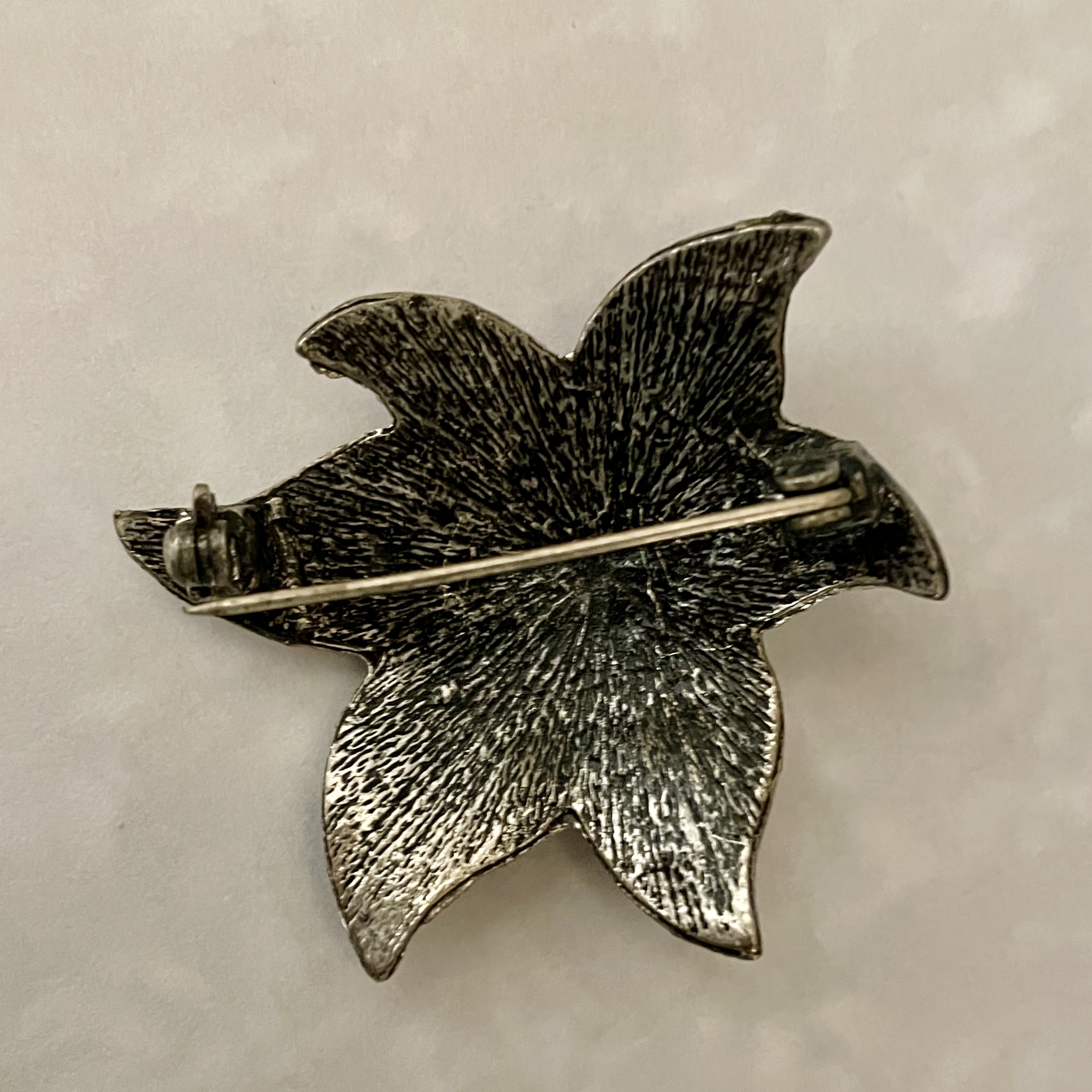 silver metal flower brooch back with clasp