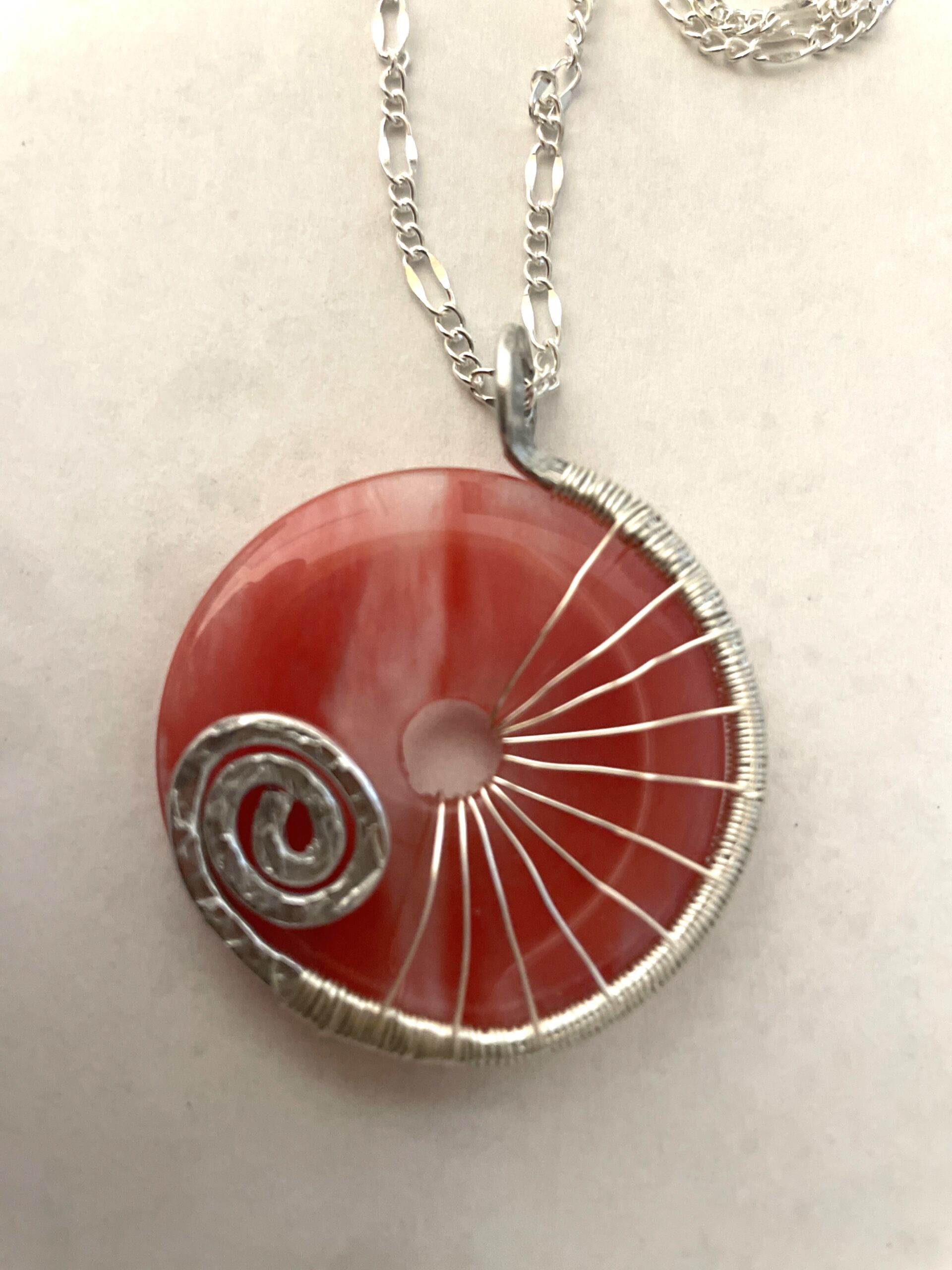 Stylish red gemstone donut necklace