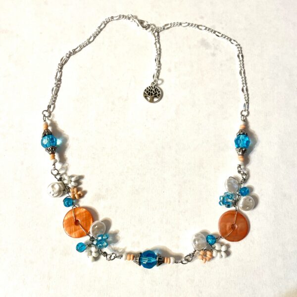 Blue and orange beaded necklace with tree charm