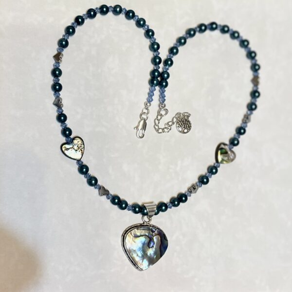 Heart-shaped abalone pendant on beaded necklace