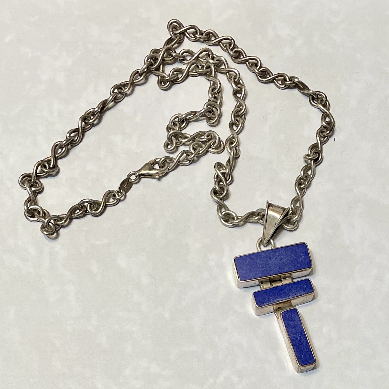 Silver chain necklace with blue geometric pendant