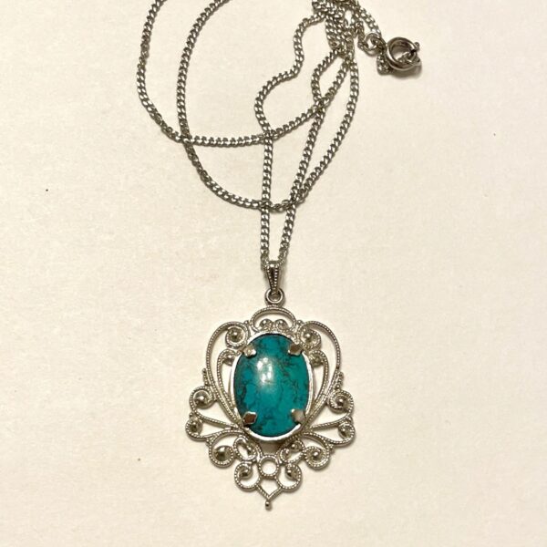 Silver filigree pendant with turquoise stone