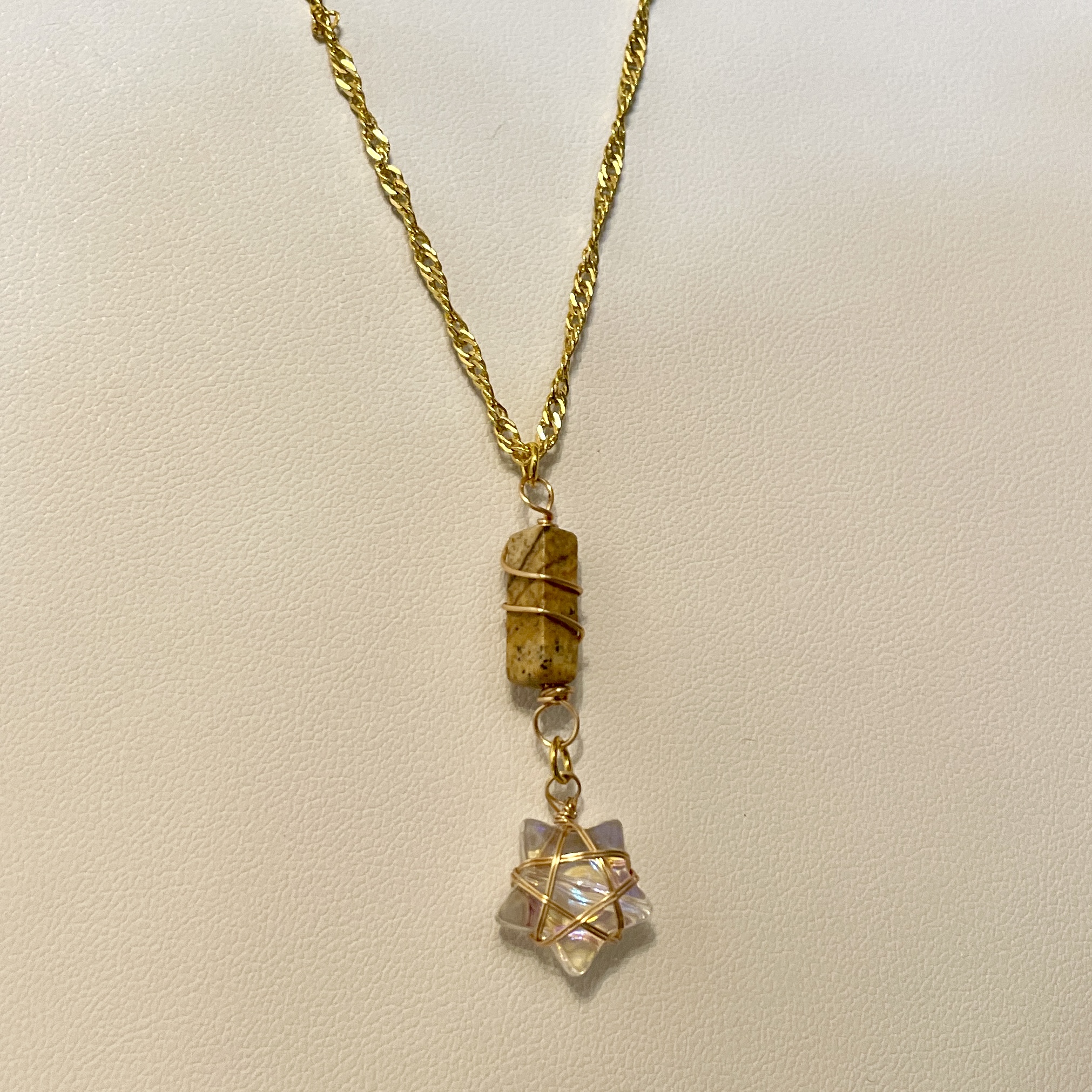 Gold chain necklace with two wire-wrapped pendants