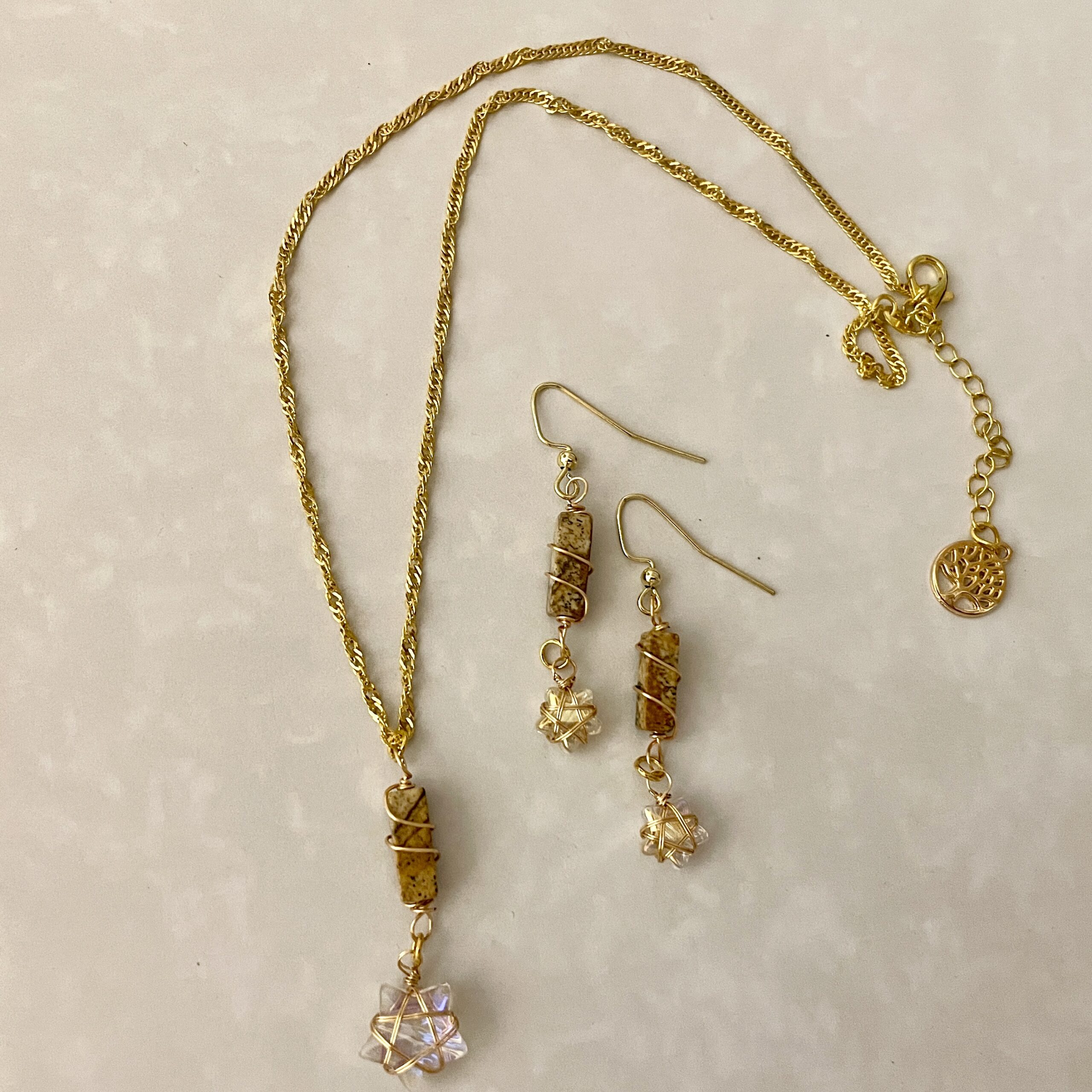 Gold necklace and earrings with star charms