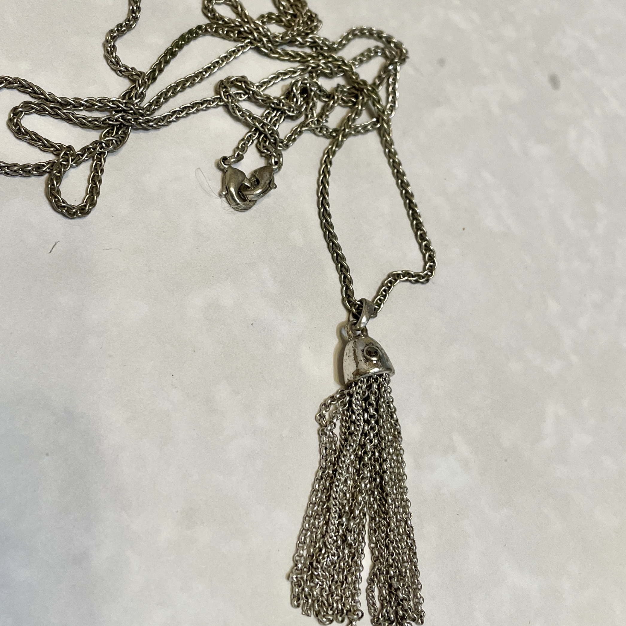 Stylish silver chain with dangling tassel