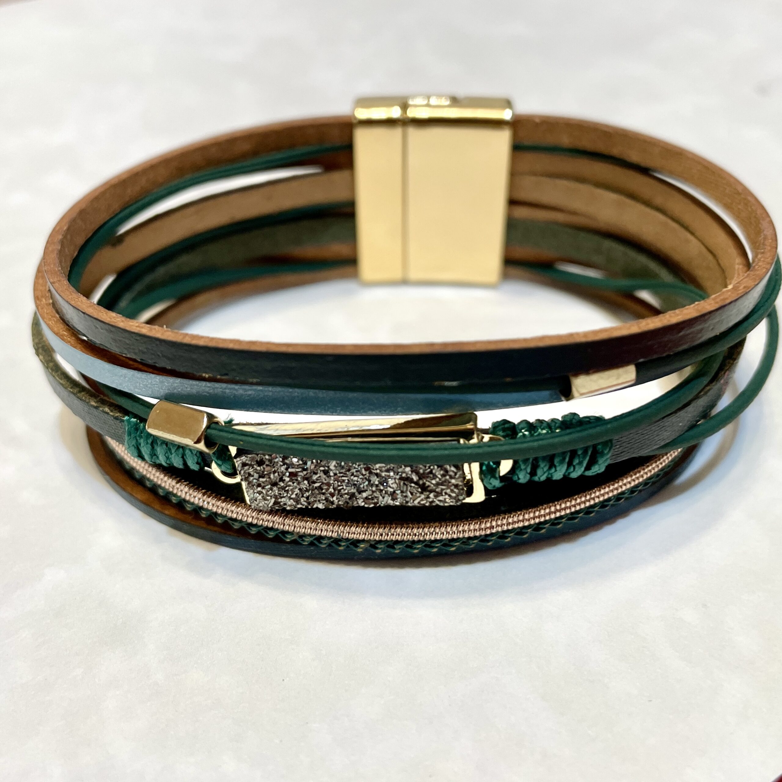 Multi-strand leather bracelet with rhinestone bar