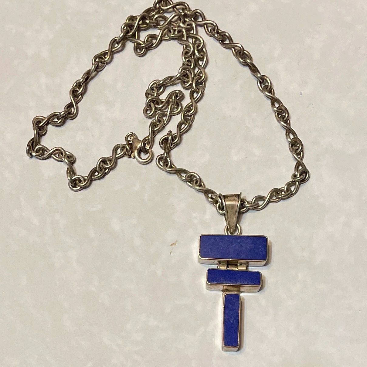 Silver chain necklace with blue T-shaped pendant