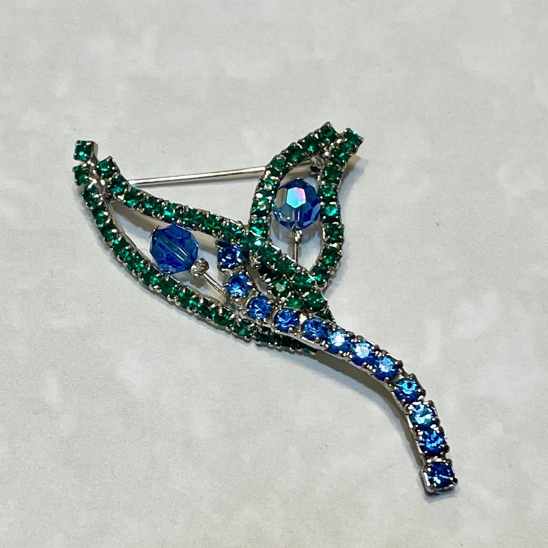 Green and blue crystal hummingbird brooch