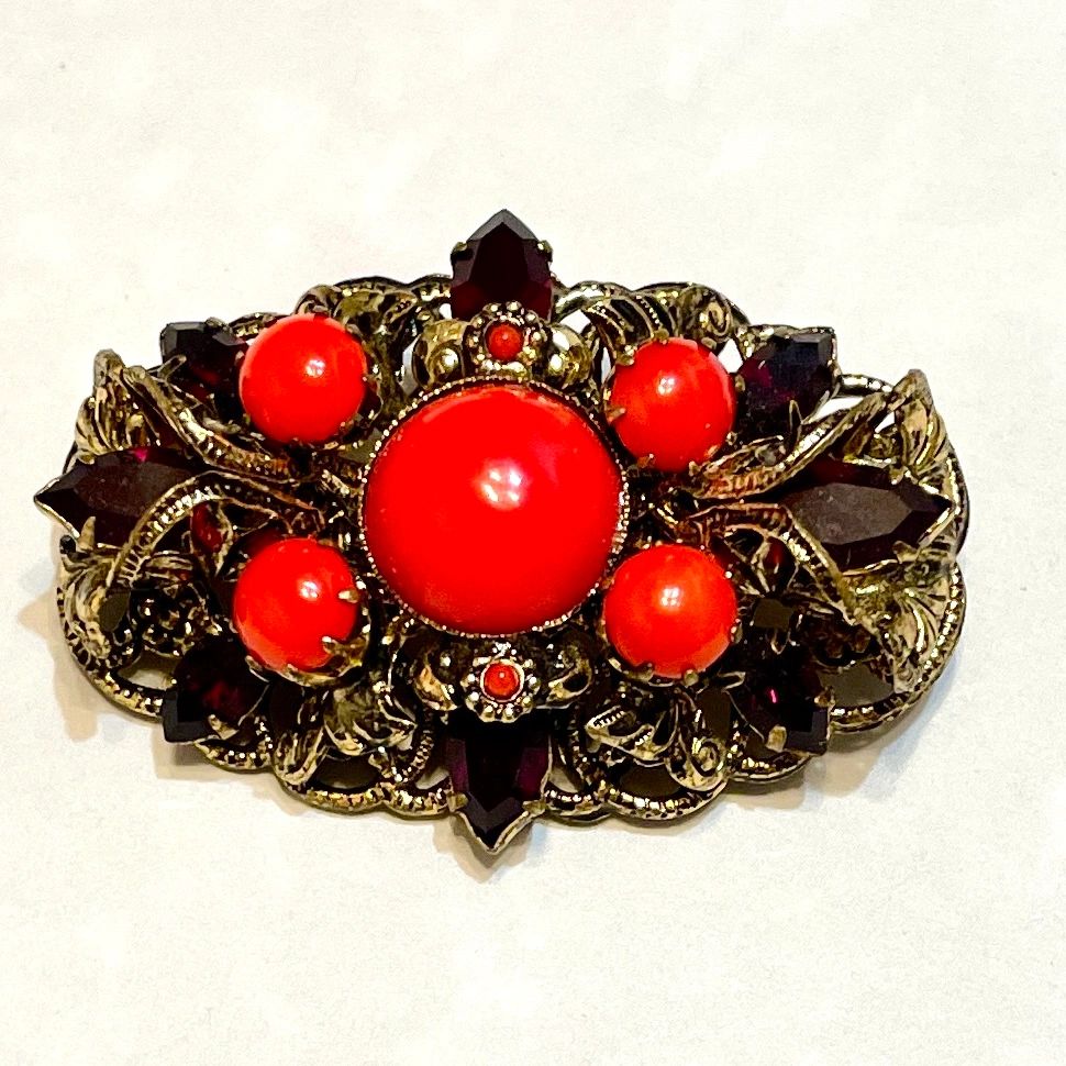 Antique filigree brooch with red cabochons