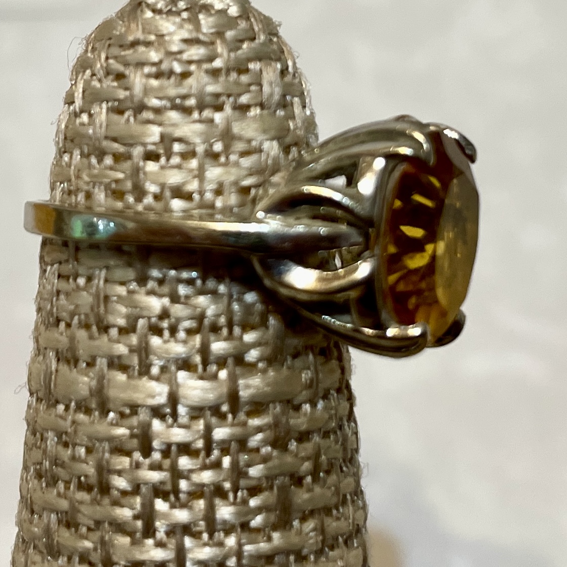 Elegant ring featuring a large yellow stone.