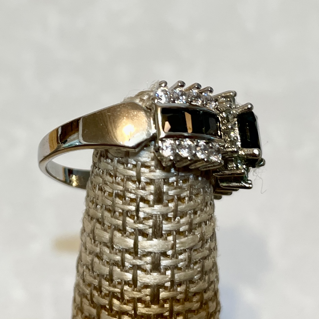 Elegant ring featuring black stones and diamonds.