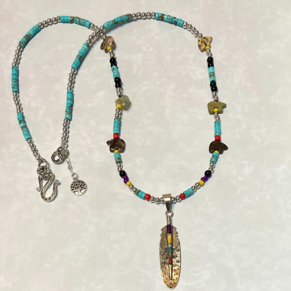 Beaded necklace featuring a feather pendant
