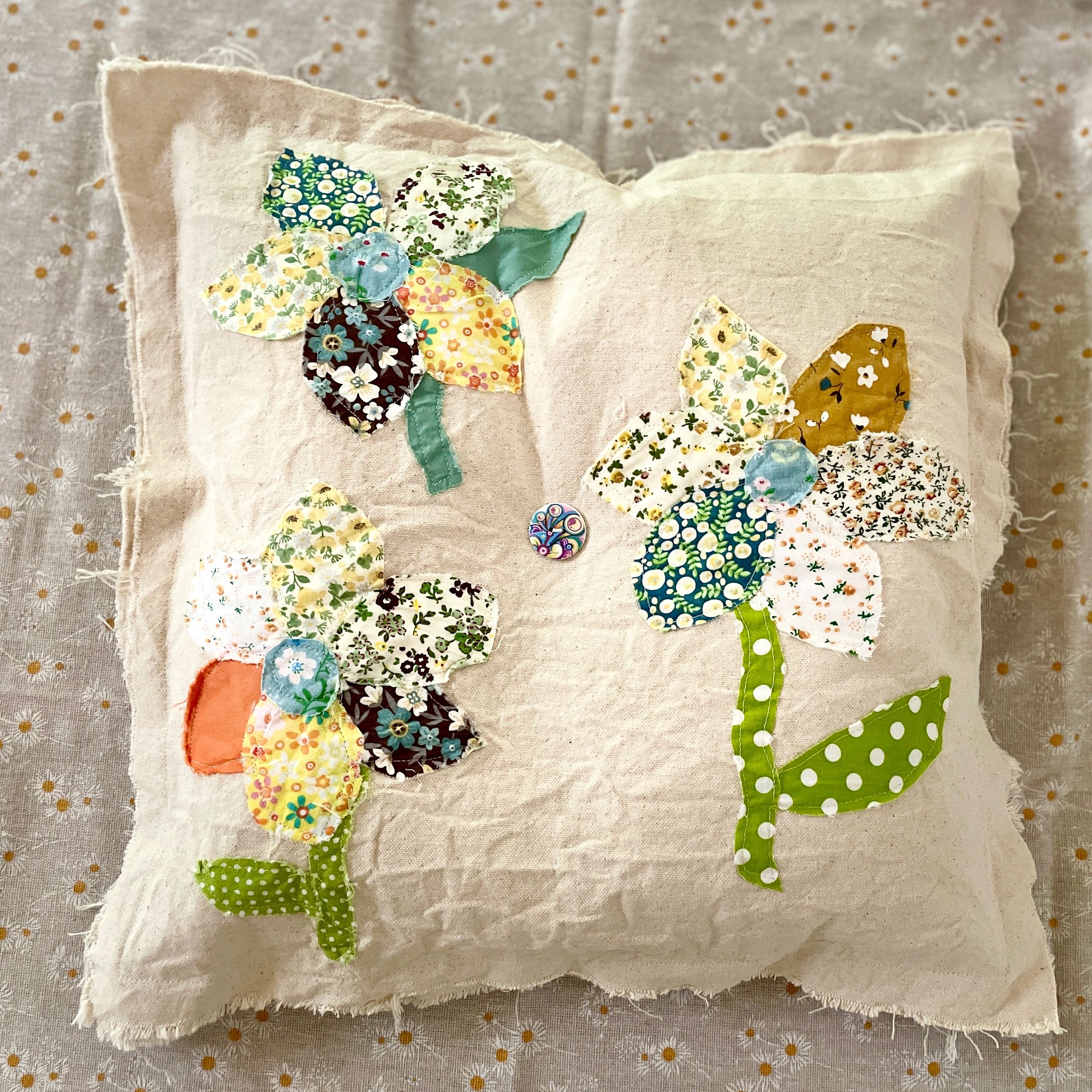 Linen pillow with patchwork fabric flowers