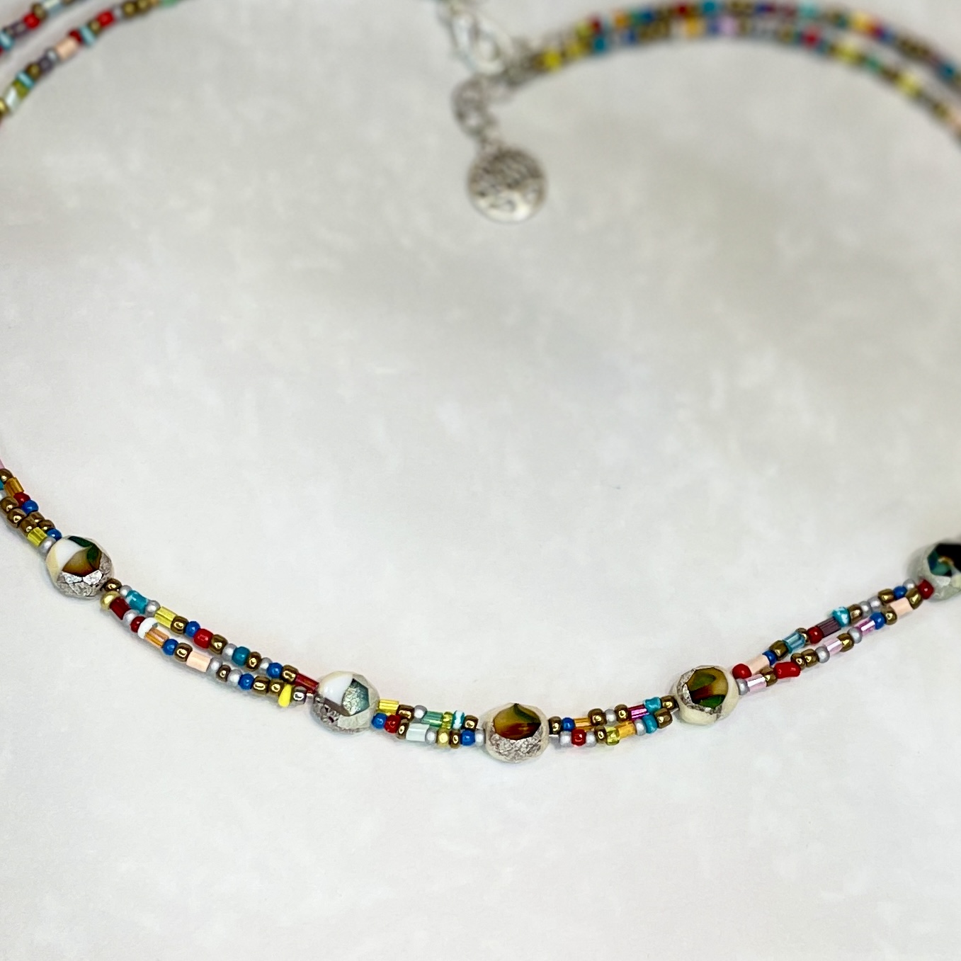 Colorful beaded choker necklace with metallic accents