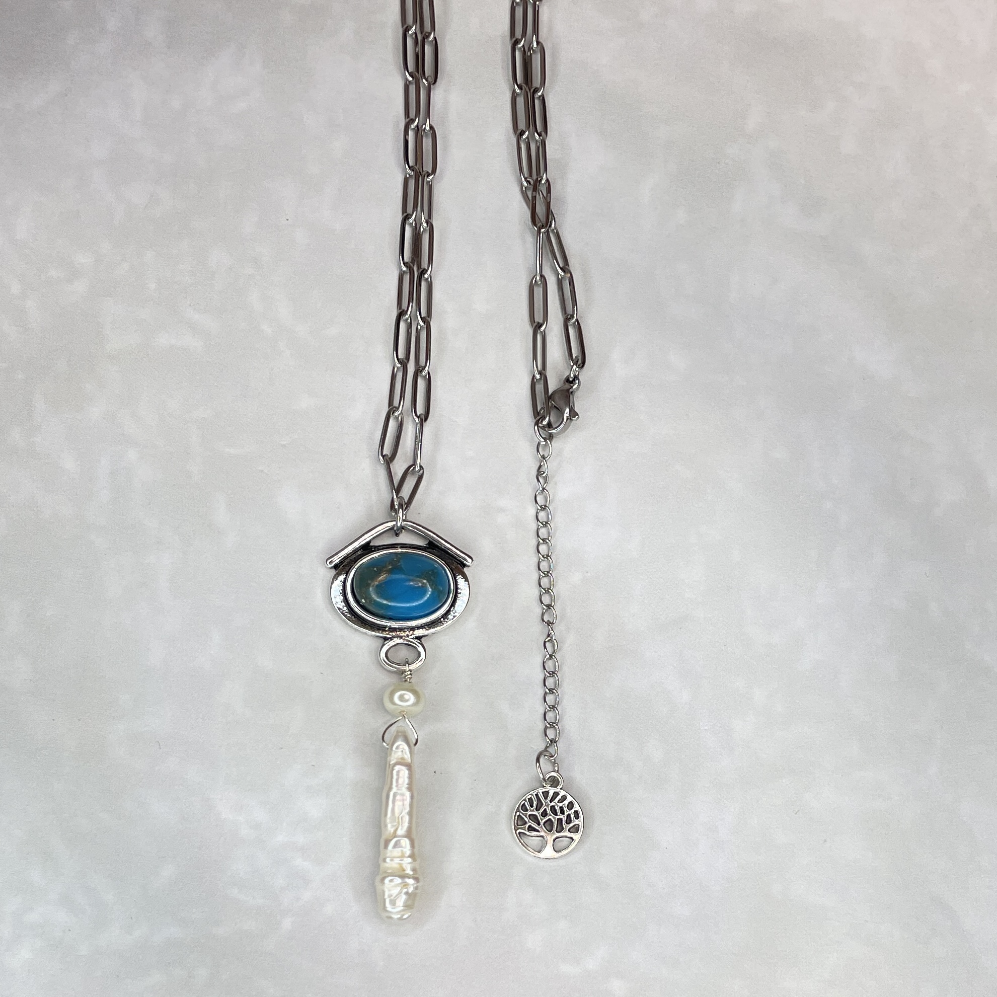 Silver necklace with blue eye pendant and pearls