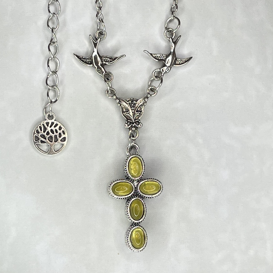 Silver necklace with yellow stone cross pendant
