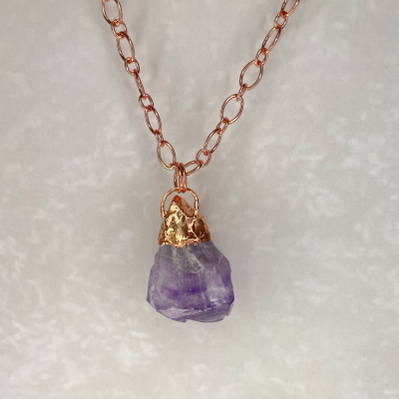 Raw amethyst pendant with rose gold chain