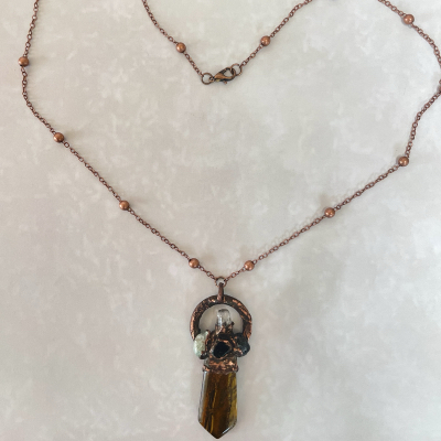 Copper beaded necklace with brown crystal pendant