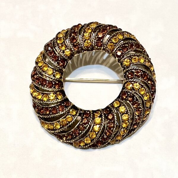 Vintage brooch with golden stones