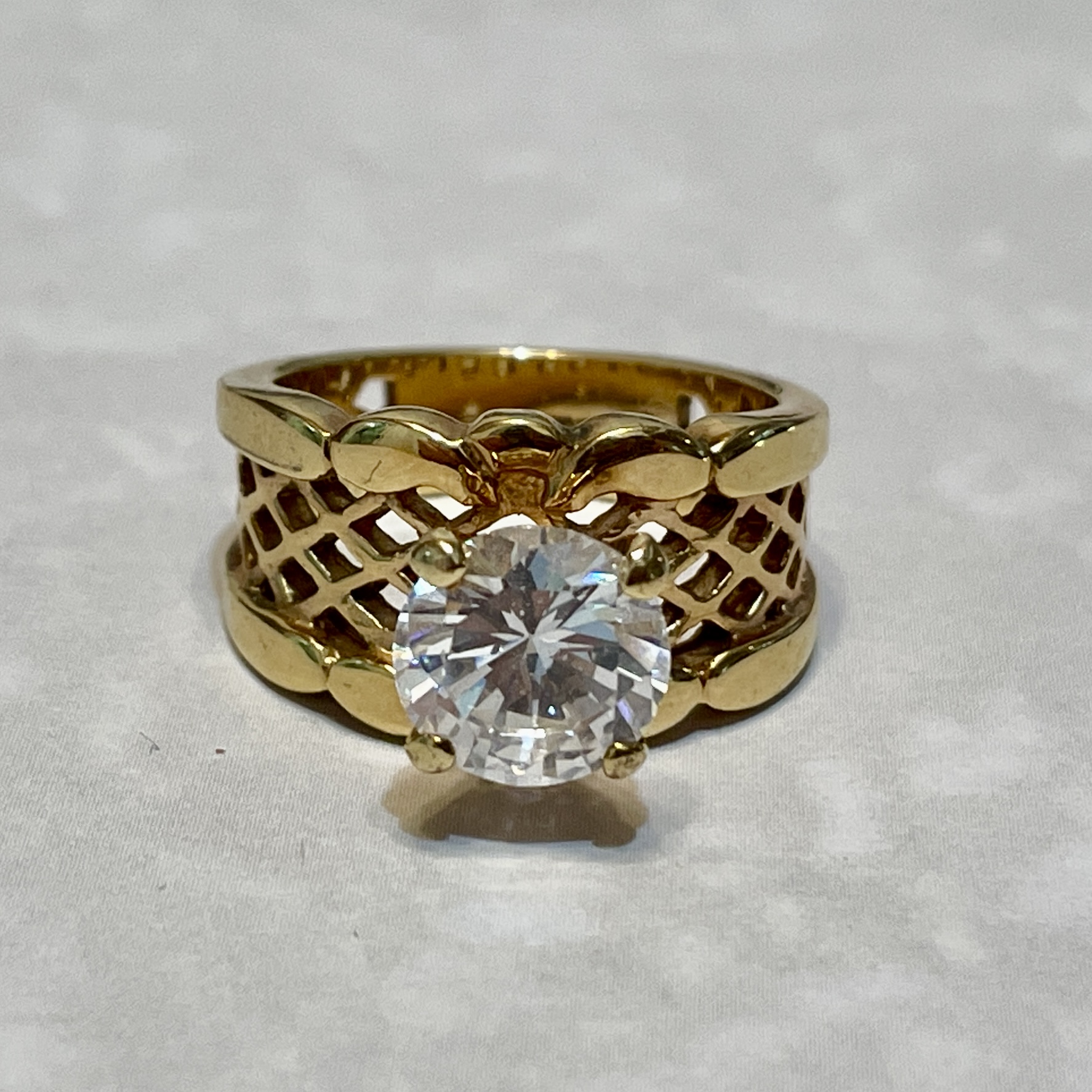 Gold ring with large round diamond.