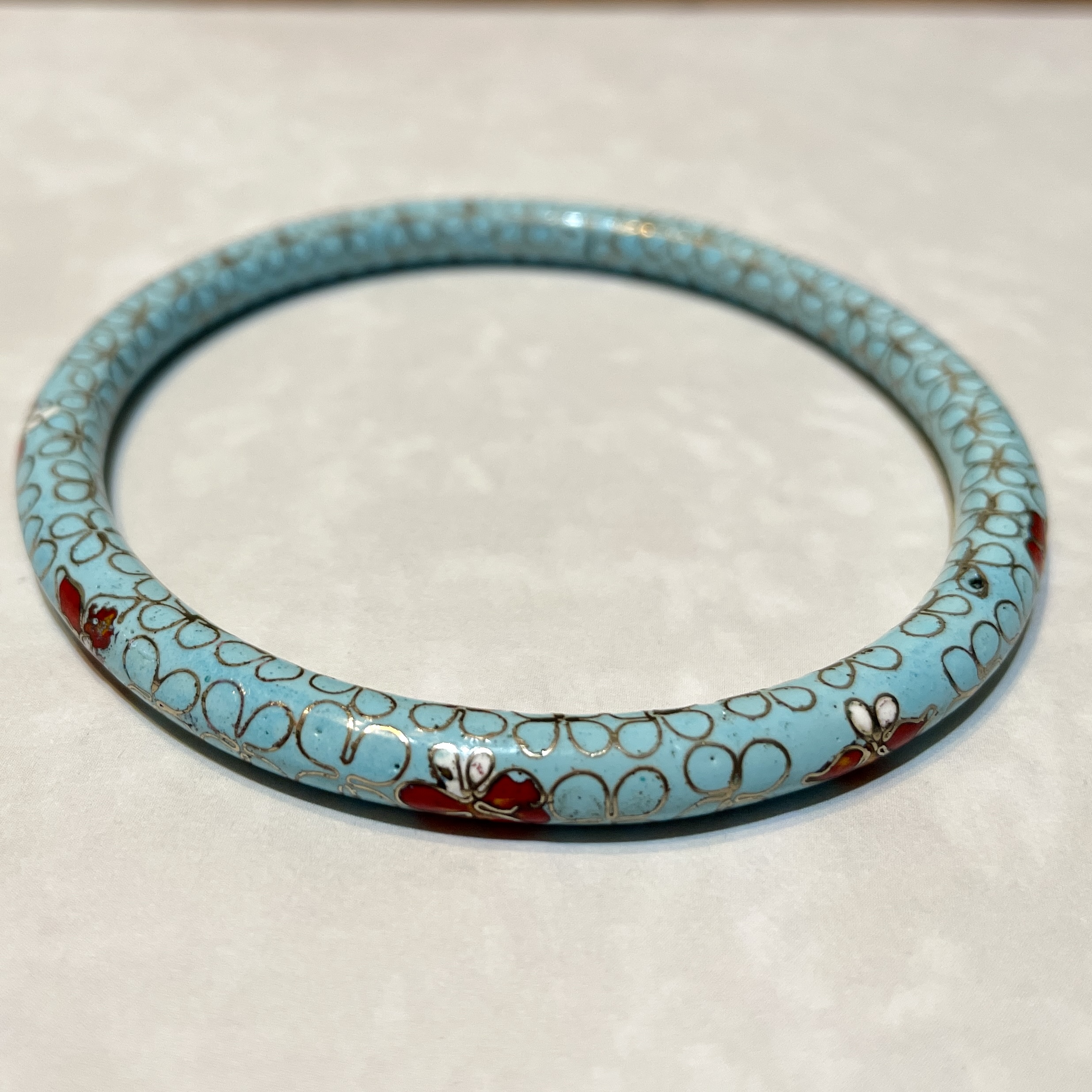 Elegant turquoise bangle with floral design
