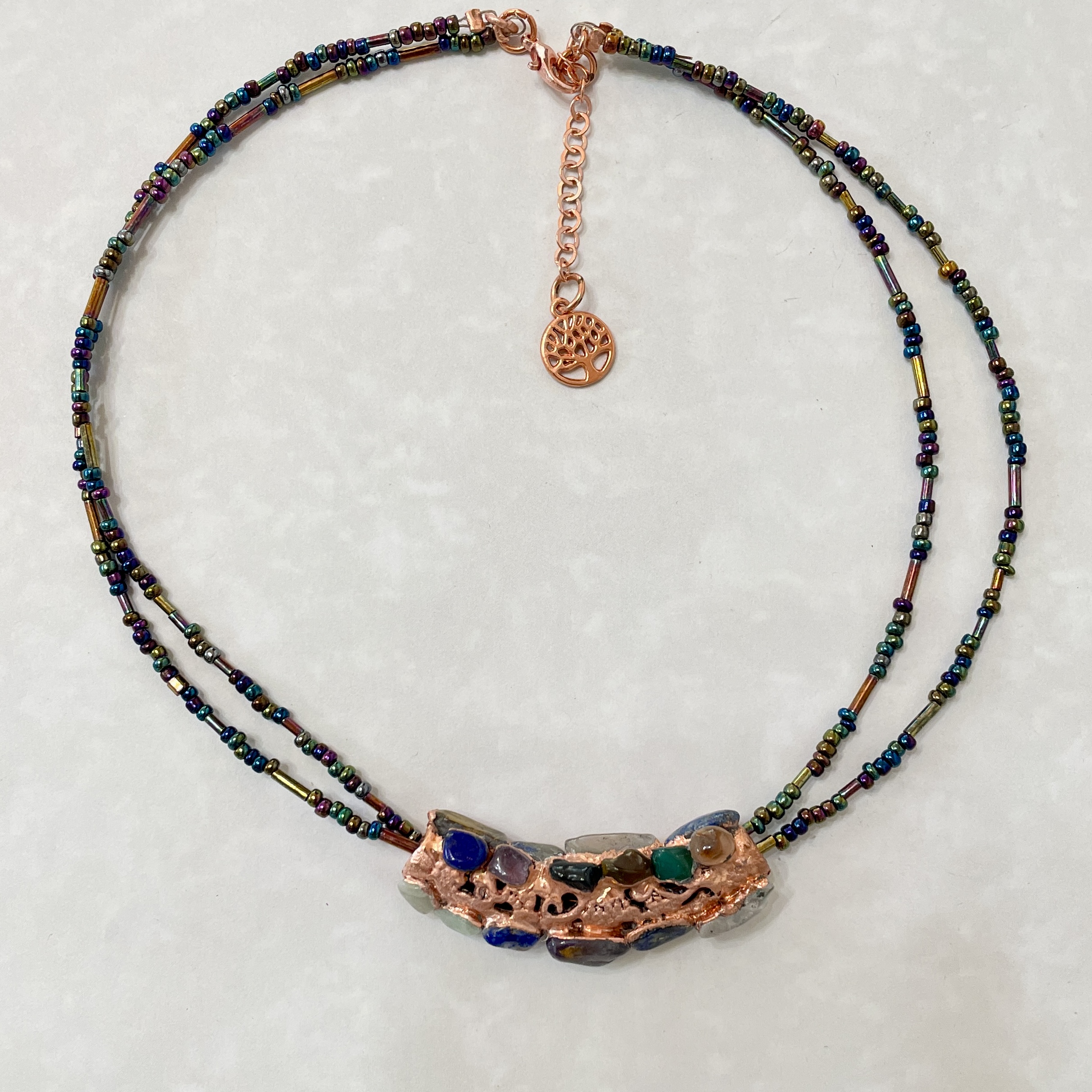 Double-strand beaded necklace with copper pendant