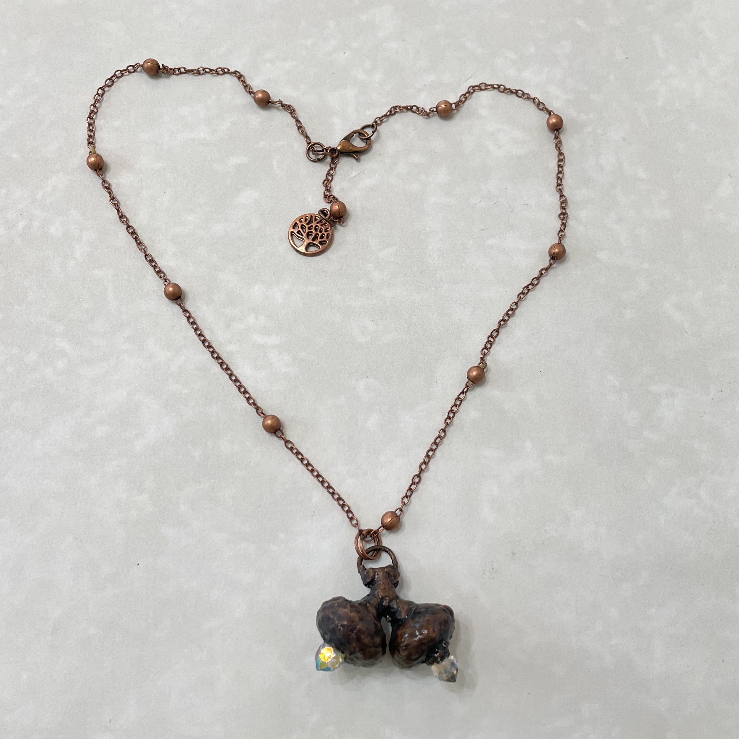 Copper beaded necklace with twin crystal pendant