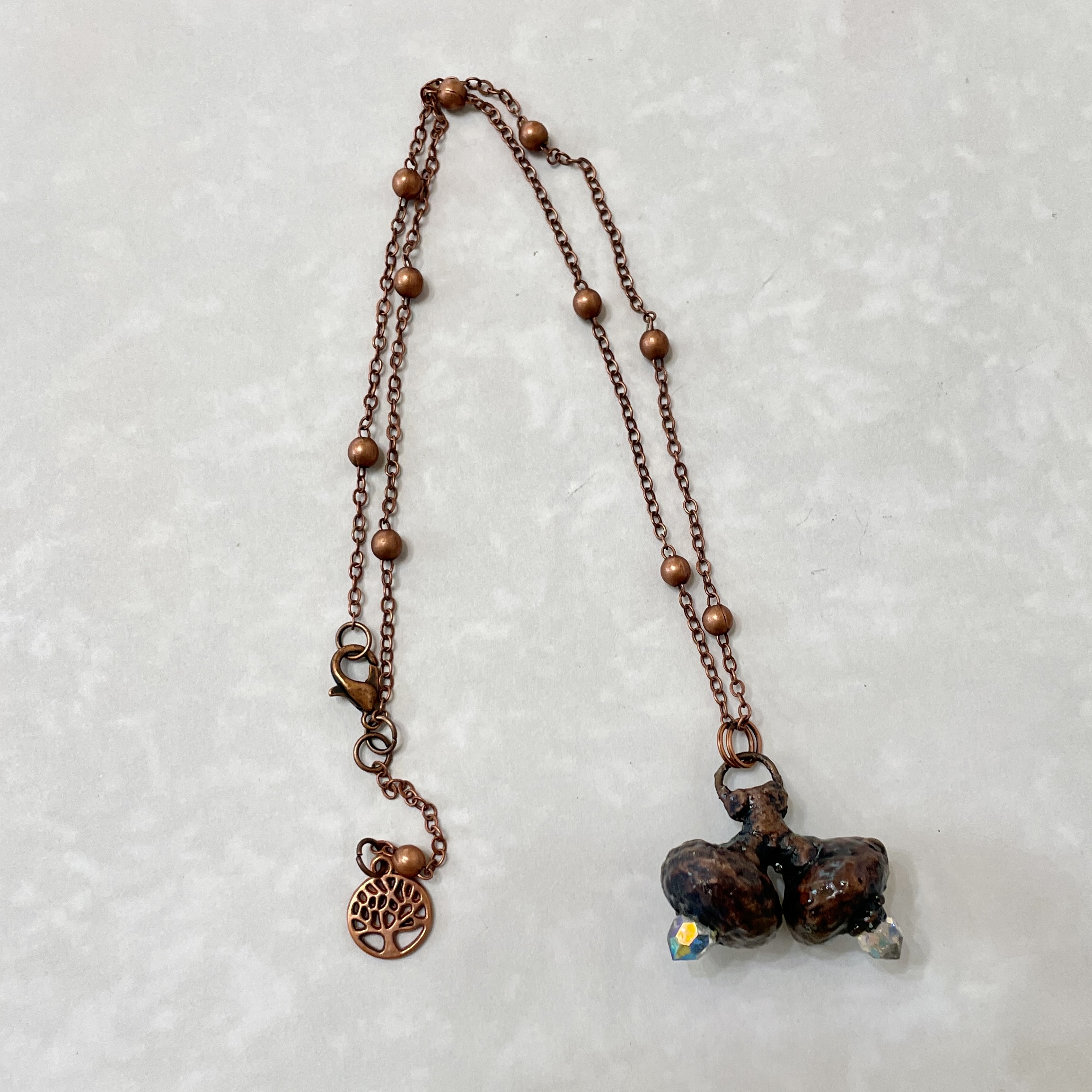 Copper chain necklace with three-stone pendant