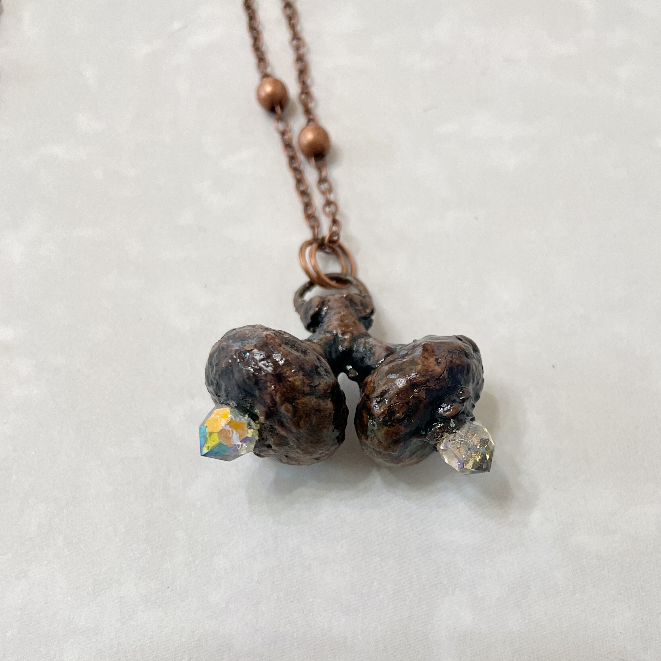 Copper necklace with three brown bead pendant