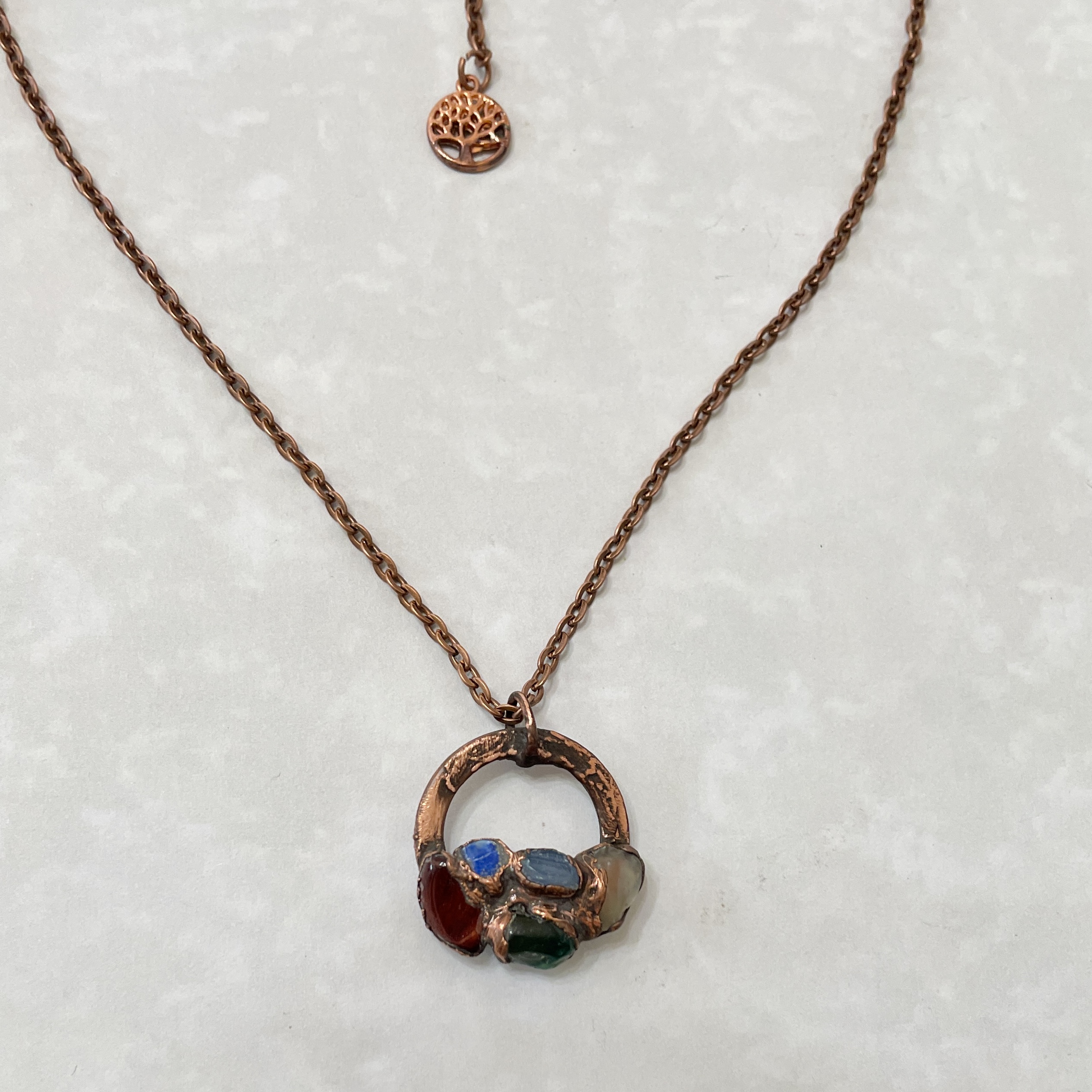 Copper necklace with multicolored stone pendant