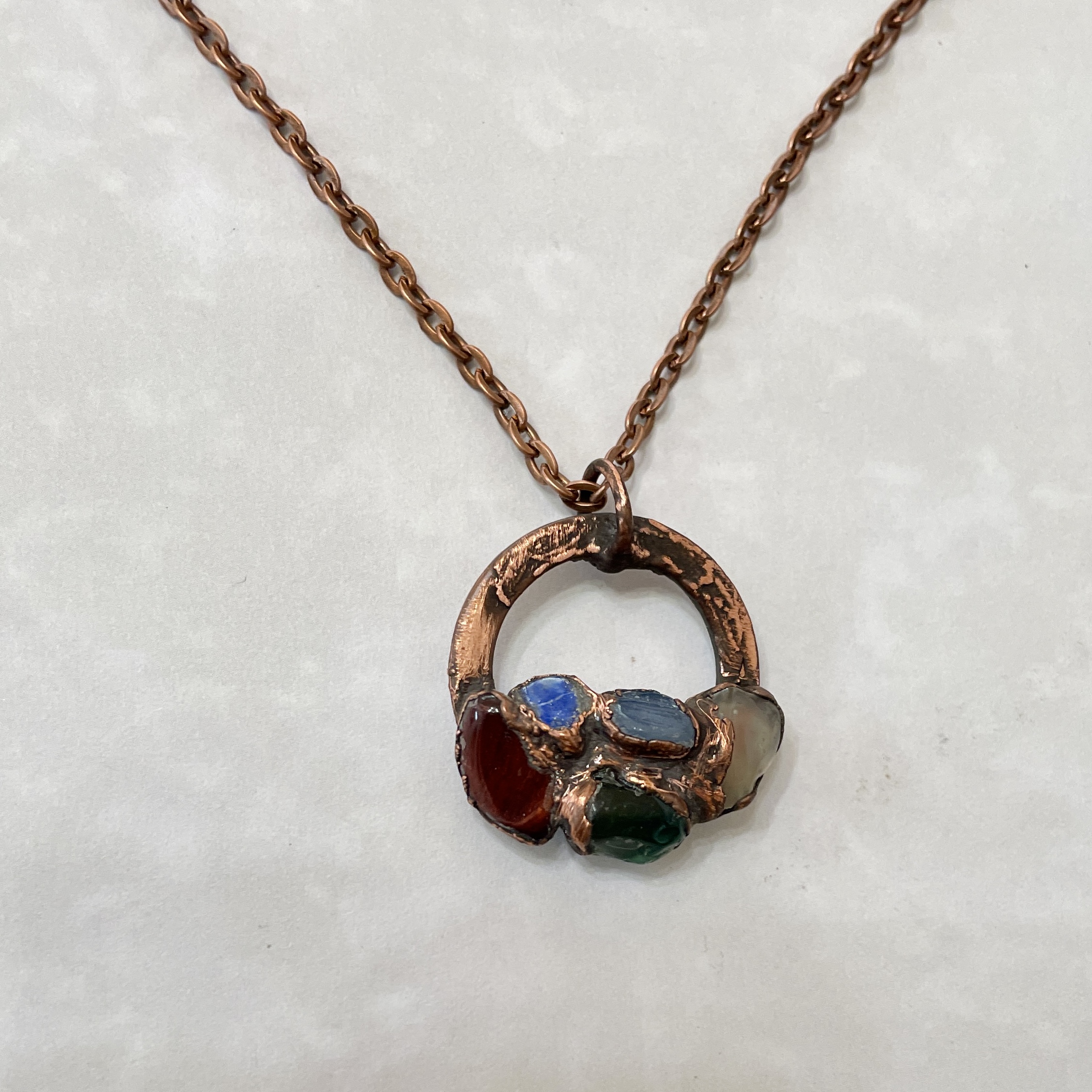 Artistic copper necklace with colorful gems
