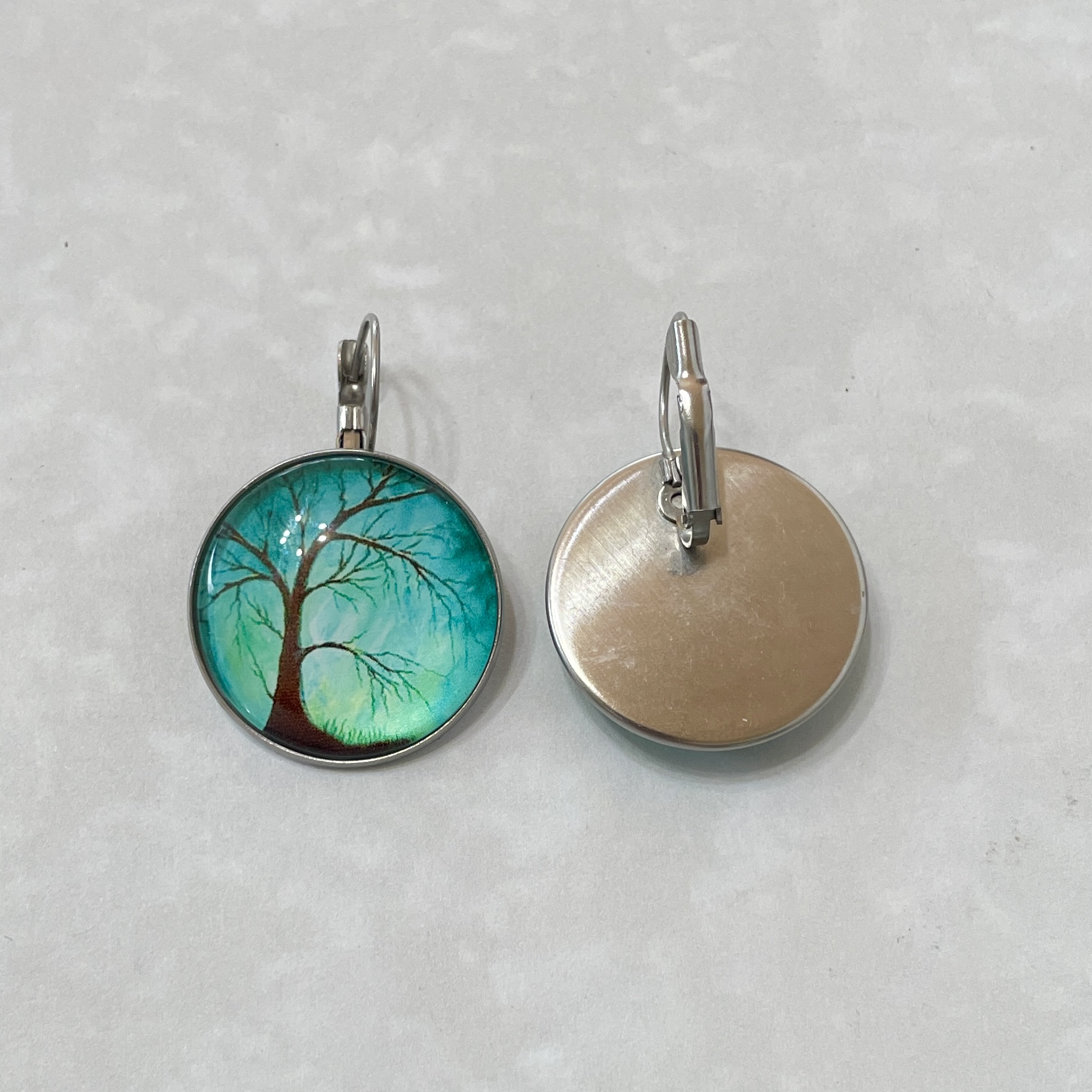 Round teal tree earrings, front and back