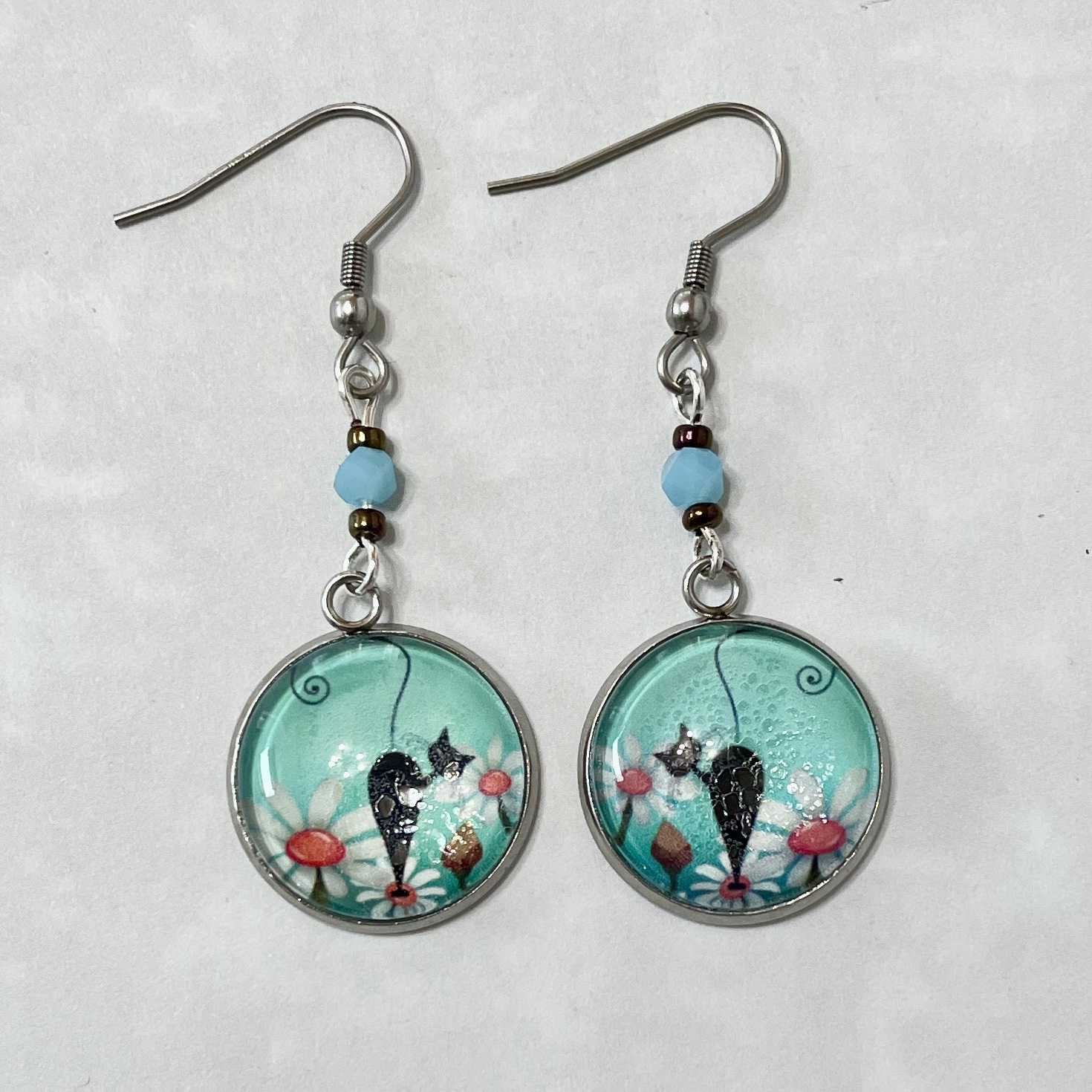 Pair of teal cat pendant dangle earrings