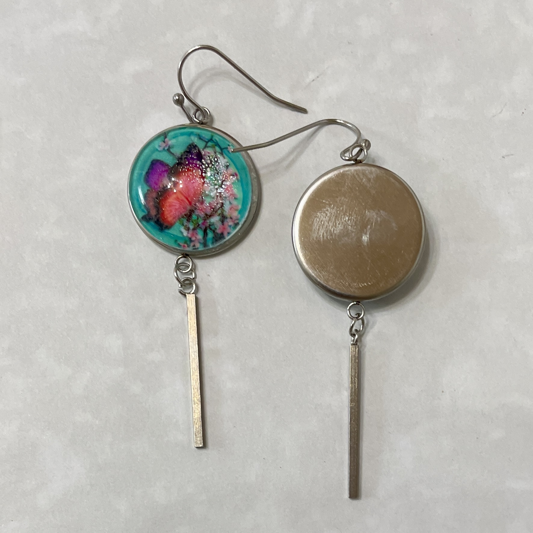 Silver dangle earrings with colorful resin disc