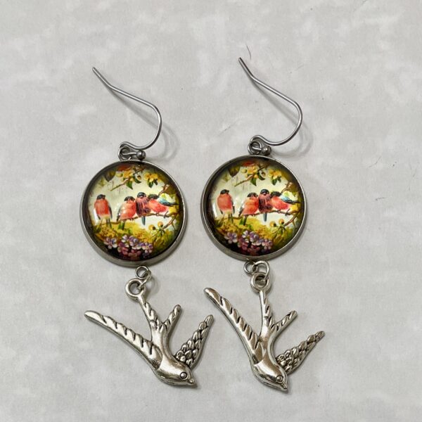 Bird-themed dangle earrings with silver swallow charms