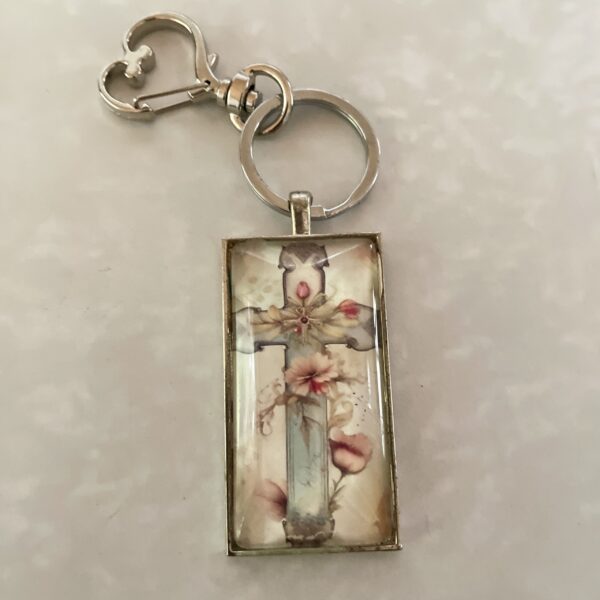 Rectangular keychain pendant with floral cross design