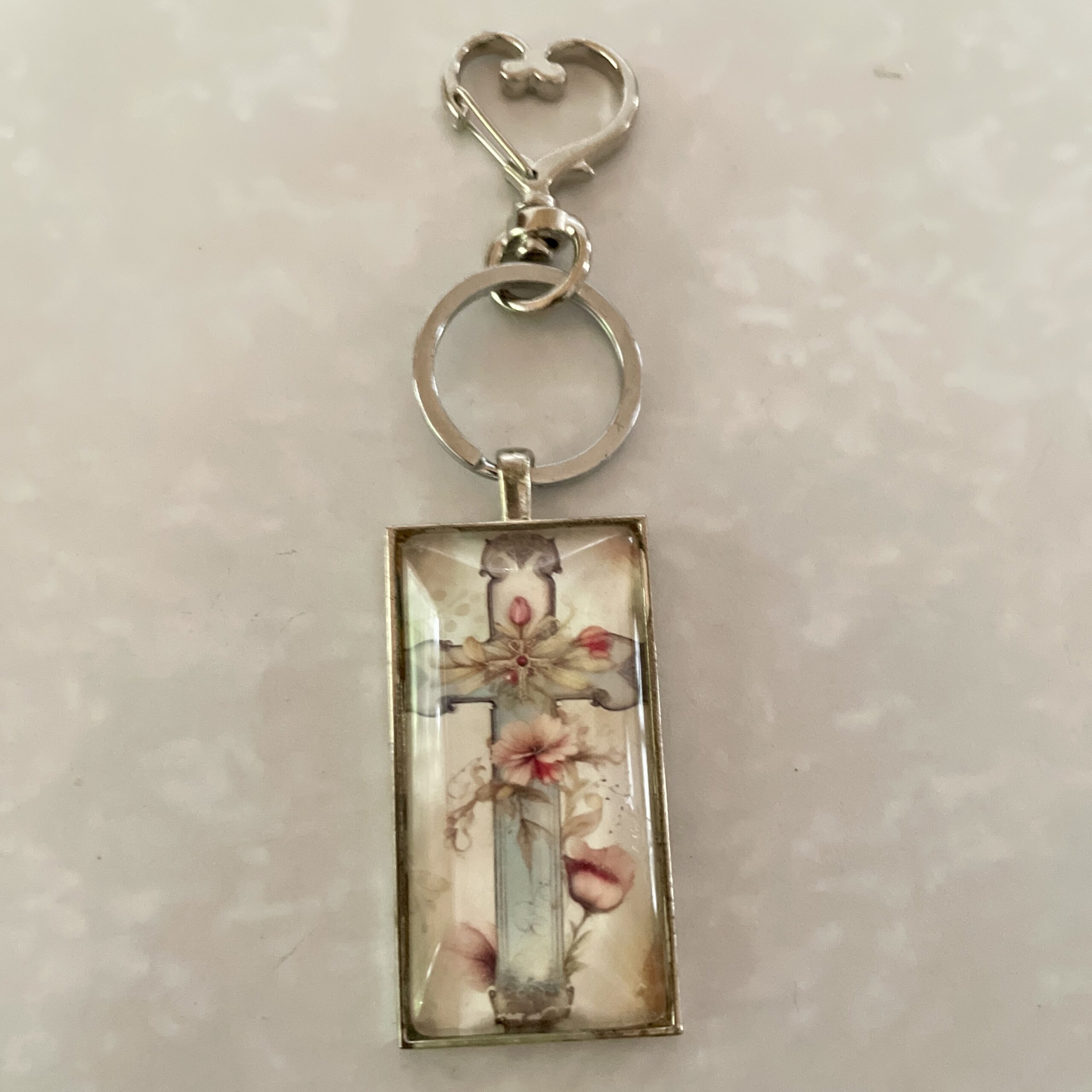 Cross floral keychain with heart clasp