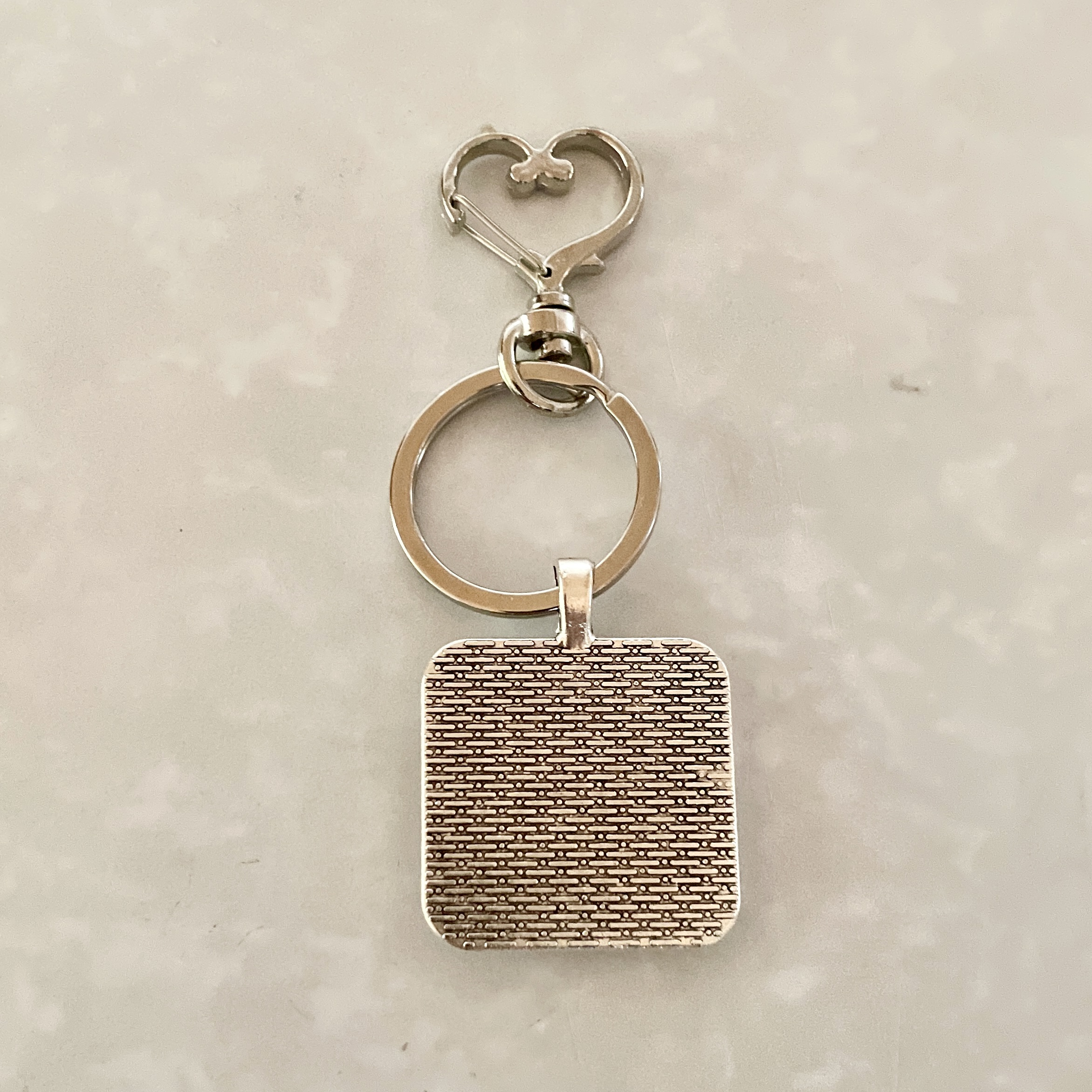 Textured square pendant keychain with heart clasp