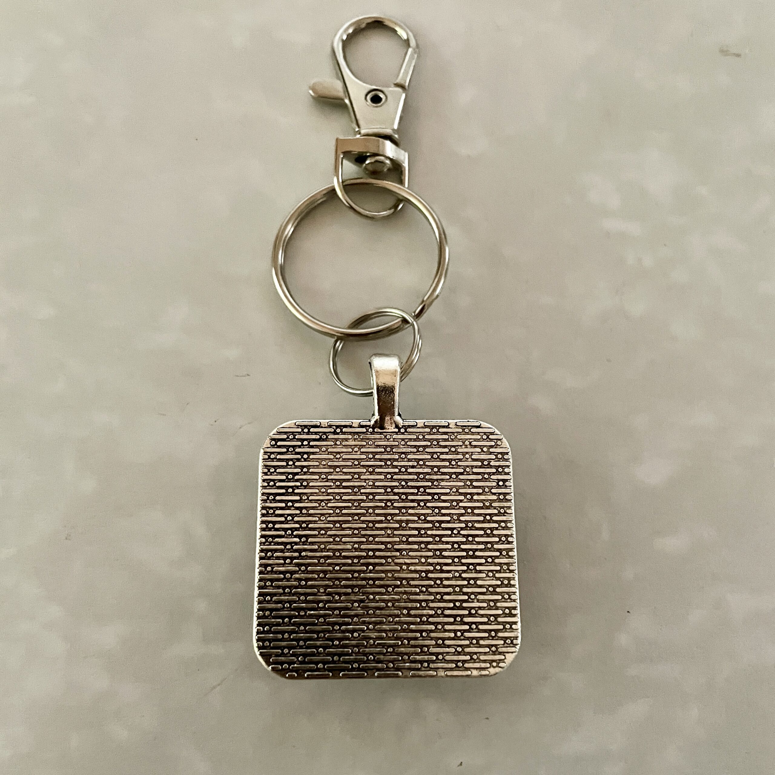 Square textured metal keychain with lobster clasp