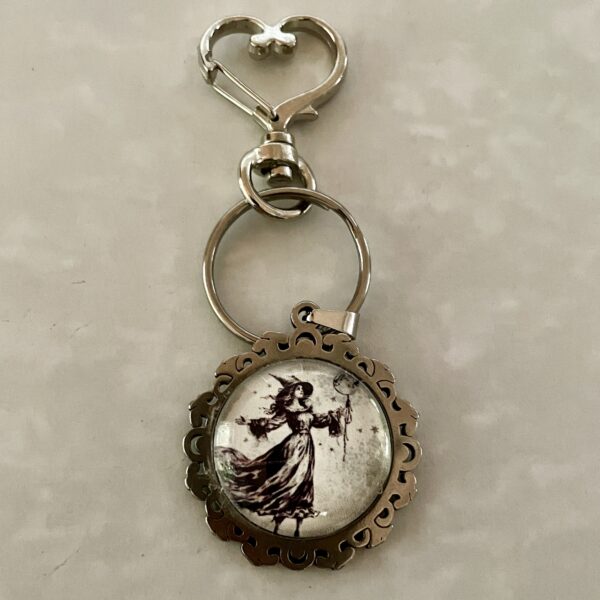 Round ornate keychain with vintage woman illustration