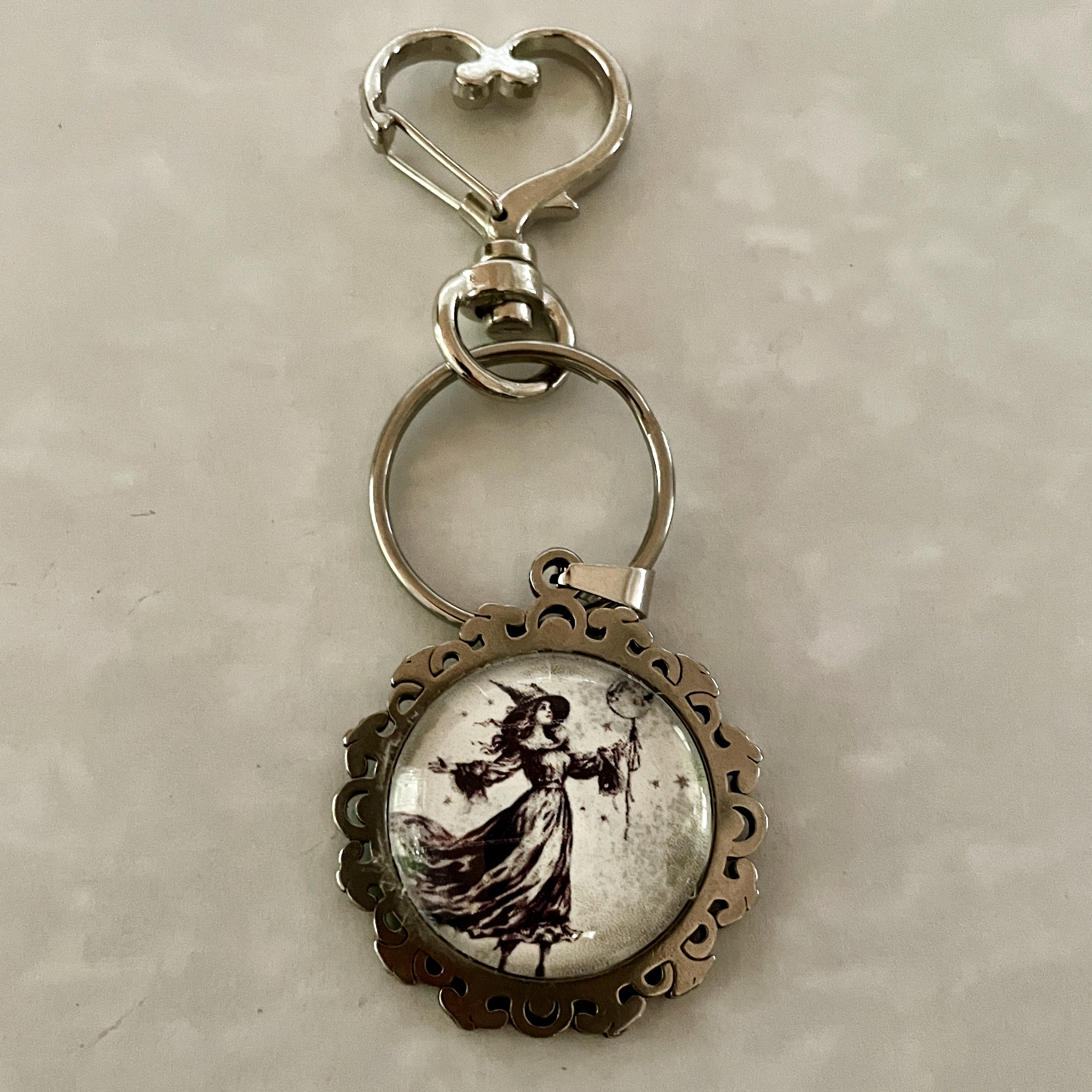Round ornate keychain with vintage woman illustration