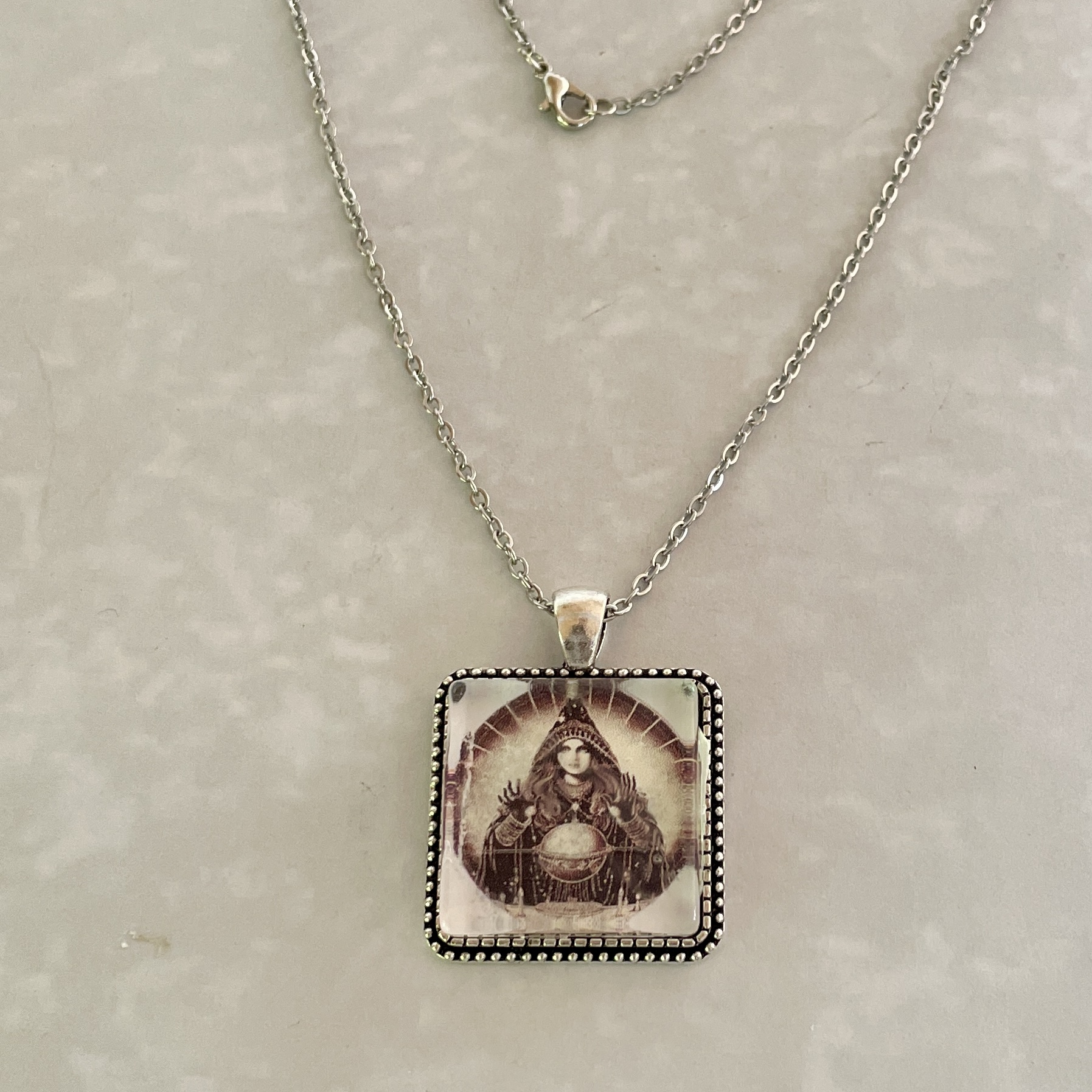 Silver chain with vintage fortune-teller pendant