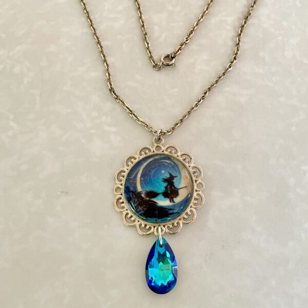 Gold necklace with witch moon pendant and crystal